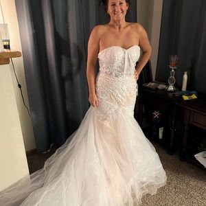 Custom made blush and white wedding dress with gorgeous chapel train.